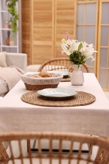 Stylish table with chairs and decor in dining room. Interior design
