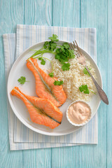 baked salmon steaks with rice, cilantro and sauce