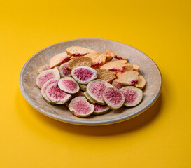Dried sublimated fig and peach slices as an ingredient for desserts. Dried figs and peaches