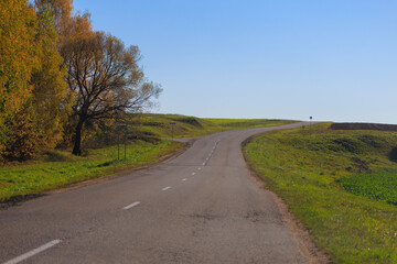 Autumn landscape, road and highway, asphalt and roadside.