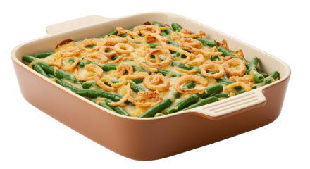 Green bean casserole in baking dish topped with fried onions on transparent background