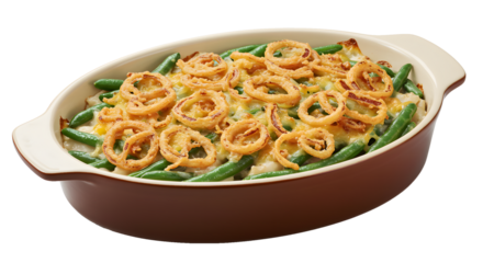 Green bean casserole with fried onion topping in a baking dish on transparent background