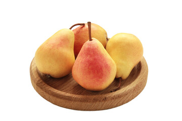 Fresh pear fruit on wooden plate isolated on white background. Healthy fruit