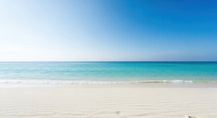 Obraz premium Tranquil beach scene; bright blue sky, turquoise water, soft white sand