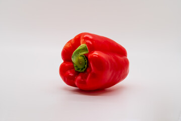 Red bell pepper isolated on a white background, food or salad element