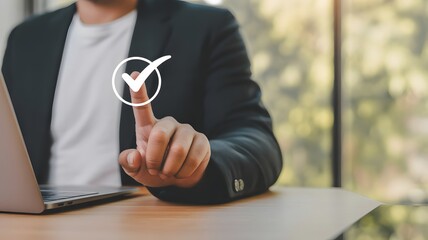 Business Checklist Achieved: A focused businessperson, seated at a wooden desk, clicks a digital checkmark over a blurred background, symbolizing task completion and successful goal achievement.