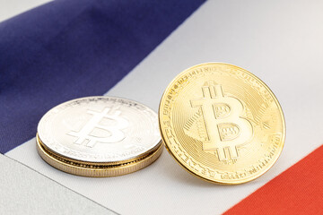 Bitcoin cryptocurrency coins on national flag of France. Crypto law regulation concept