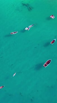 Cinematic drone footage of Santa Maria beach and pier, Sal Island, Cape Verde. Captured at golden hour with turquoise waters, fishing boats and tropical atmosphere in 4K and HD formats.