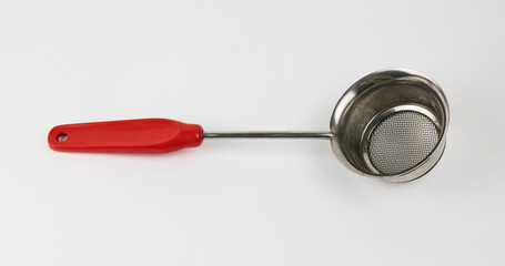 Metal strainer with red handle for kitchen use