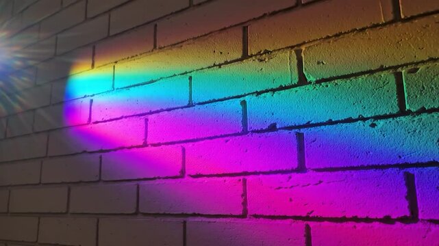 Rainbow light spectrum on white brick wall abstract background texture