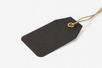 Fototapeta premium Black Tag with String isolated on white background. Blank cardboard price template