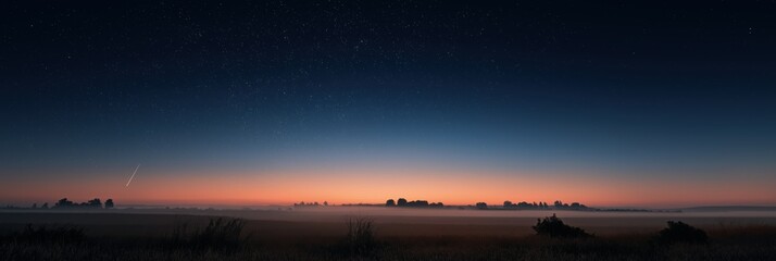Stunning twilight landscape with misty field and starry sky at dawn