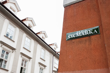 Historic Sw. Marka street corner in Krakow, Poland with distinctive architecture and street sign