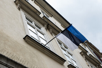Estonian flag on a historic building low angle perspective