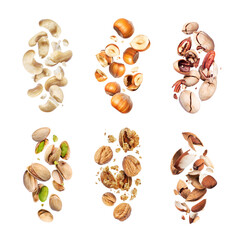 Obraz na płótnie Canvas Set of various crushed dried nuts close-up in the air on a white background