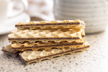 Sweet crispy wafers on kitchen table.