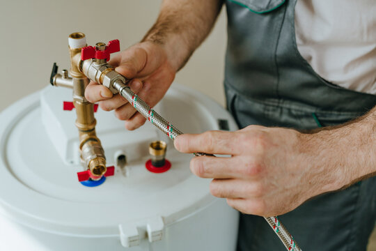 Man fixing water heater