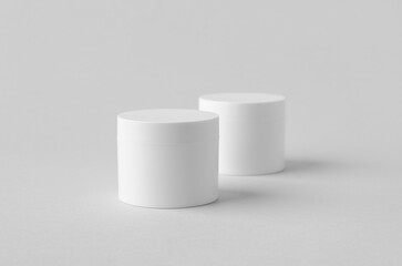 White plastic cosmetic cream jar mockup on neutral background