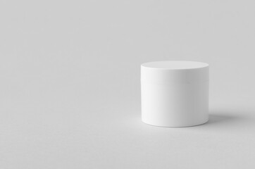 White plastic cosmetic cream jar mockup on neutral background