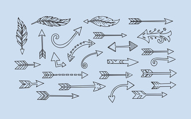 Collection of hand drawn arrows and feathers in a doodle style