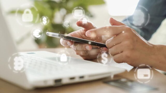 Digital transaction concept - hands typing on the phone with e-commerce icons floating around
