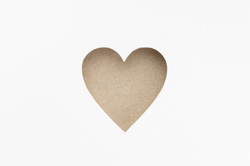 Die-cut Cardboard Heart shaped isolated on white paper background. Love concept