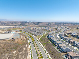 New development real estate. Aerial view of residential houses and driveways neighborhood in south San Diego, Chula Vista. Packed homes. Top view over private houses