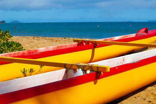 Yellow Hawaiian Outrigger Canoes on beach
