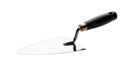 Bright trowel, black handle, lies diagonally on a black background