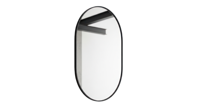 Oval mirror reflects a minimal gray ceiling, isolated on stark black background