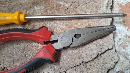 Tools of the trade, A close-up of pliers and a screwdriver