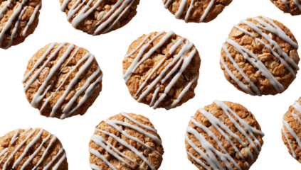 Round, light-brown cookies, topped with white icing in diagonal lines.  Close-up, flat lay