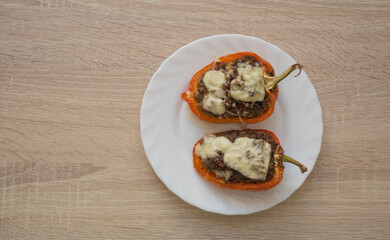 bell peppers stufed with meat, vegetables and cheese, top view