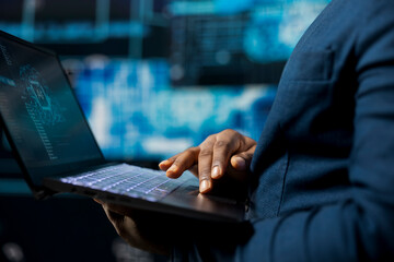 High tech black IT expert working with AI brain data structures environment, illustrating computer...