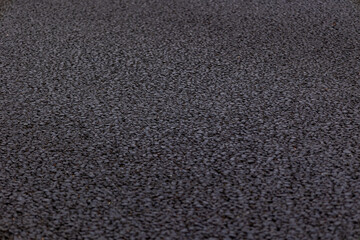 Fototapeta premium Industrial concrete surface close-up, capturing grit, wear, and weathered patterns in high resolution. 