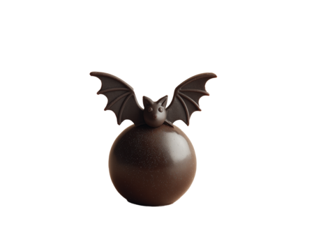 Dark chocolate bat candy isolated on white background. Halloween sweet dessert.