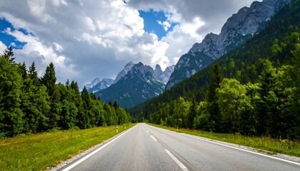 Fototapeta premium Scenic mountain road through lush forest (1)