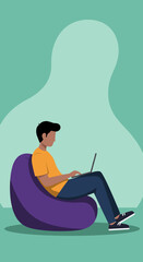 Young person comfortably working on a laptop from a bean bag chair. Ideal for remote work, online learning, or modern digital lifestyle concepts.