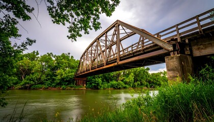 Fototapeta premium Rusty bridge over a river