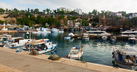 Tourist ships and yachts in ancient port at old city of Antalya, Turkey