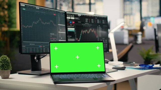 Close up of trading software in forex firm office with graphs on green screen laptop. Mockup notebook on desk used by financial specialists tracking stock exchange activity using analytical tools