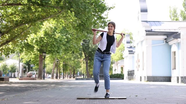 Teenage girl in tap shoes dancing outdoors