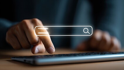 Hands using a keyboard & digital search bar