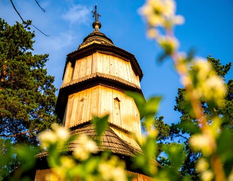 Wooden church tower, sunlit - Powered by Adobe
