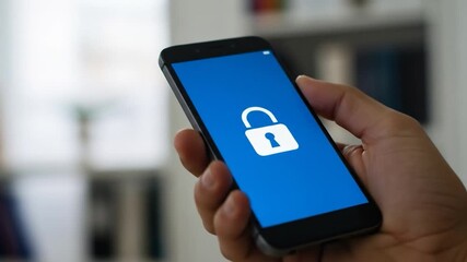 Mobile device displaying security lock in hand data protection and digital security concept - Powered by Adobe