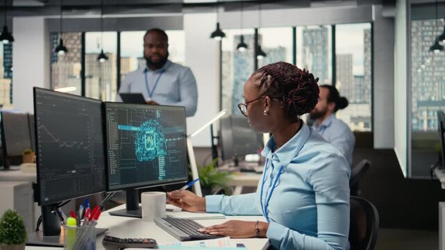 Portfolio managers using artificial intelligence to analyze stock market trends and enhance investment returns. Coworkers use AI chatbot to identify investment opportunities, camera A