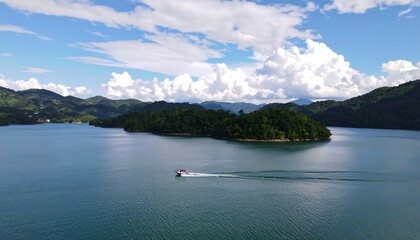 Scenic lake with boat and mountains