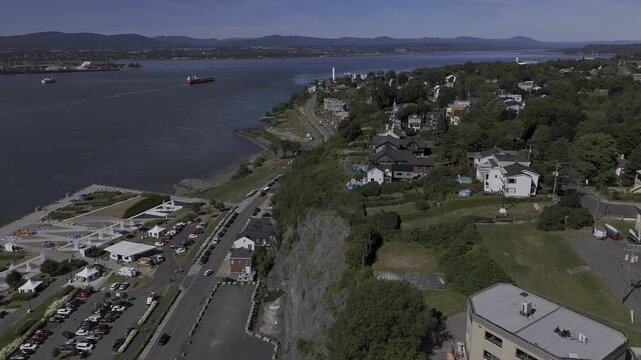 Drone flies north over the Escalier Rouge and along Rue Saint-Laurent on sunny summer day in Levis, Quebec, Canada