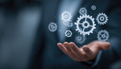 Hand holding interlocked gears, symbolizing complex system management