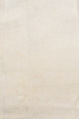 Close up view of cream linen fabric, texture of woven cream cotton fabric